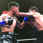 Willie Gomez, left, exchanges punches with Hamilton Ash during their four-round welterweight bout at the Emerald Queen Casino in Tacoma on Sept. 7. COURTESY PHOTO