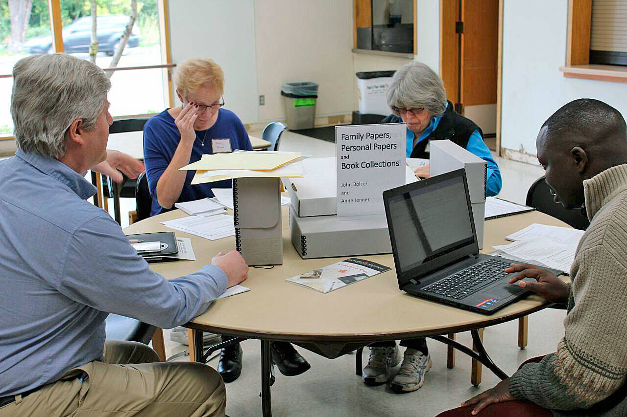 Participants occupy a table for a family and personal papers session during the 2017 Kent We Are History Keepers Workshop. COURTESY PHOTO, Ethnic Heritage Council