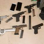 Guns found during a search warrant by Seattle Police at a suspected drug dealers Kent home on the East Hill. COURTESY PHOTO, Seattle Police