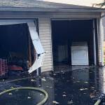 Kent firefighters put out apartment complex garage fire