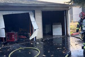 Kent firefighters put out apartment complex garage fire