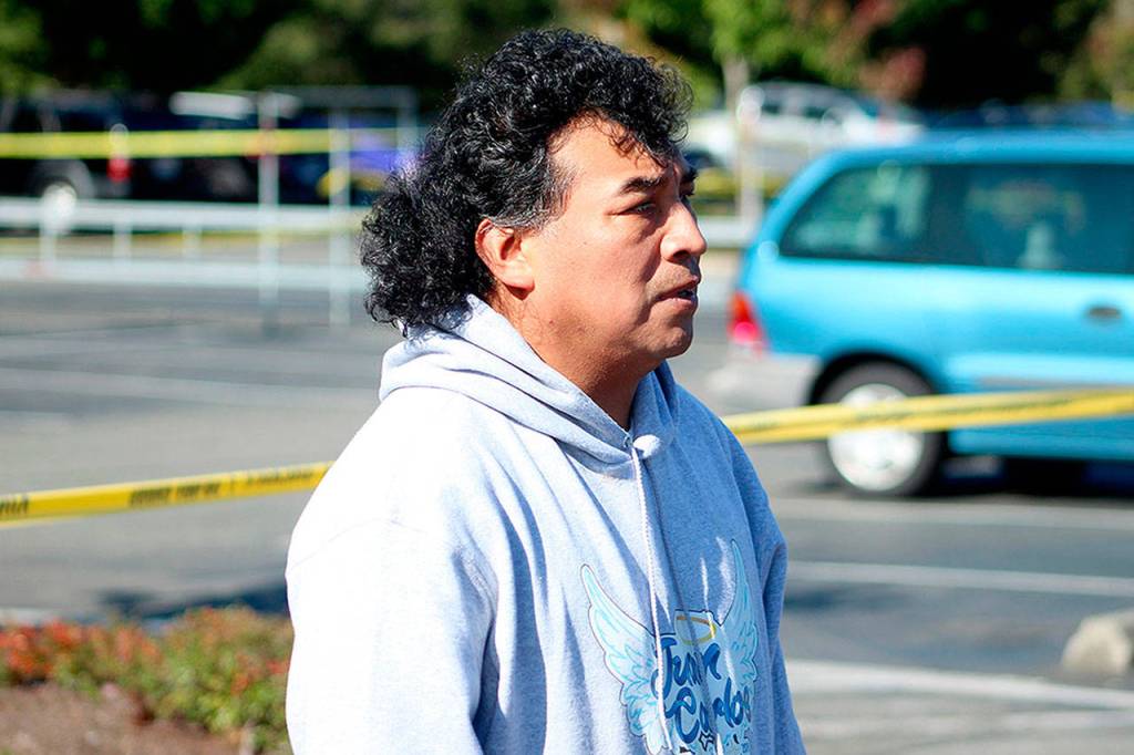 Juan Carlos Con, father of Juan Carlos Con Guzman, pictured on scene in Federal Way at the arrest of a 28-year-old man suspected to have killed his son last month. OLIVIA SULLIVAN, Federal Way Mirror