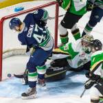 The Thunderbirds Lucas Ciona pushes the puck past Raiders goalie Boston Bilous for his first career WHL goal Tuesday night. COURTESY PHOTO, Brian Liesse, T-Birds