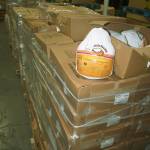 Forklifts transported cases of turkey donations for unloading in the warehouse.