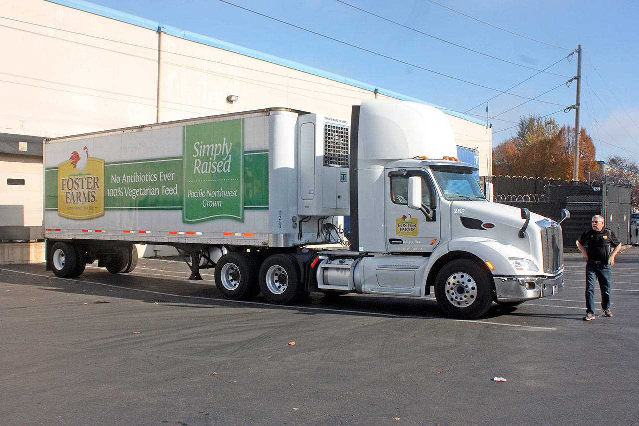 Jim Florek arrives at the Northwest Harvest main warehouse off West Valley Highway in Kent from the Kelso-Longview area to deliver turkeys. MARK KLAAS, Kent Reporter