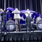 Boeing employees and alumni, city and project leaders unveil the newly-constructed replica of the interactive lunar rover during a ceremony at the Lunar Rover STEM Festival at the accesso ShoWare Center on Thursday. MARK KLAAS, Kent Reporter