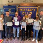From left to right, Northwood Middle School Principal Sherilyn Ulland, teacher Peter Peng, custodian Salvador Contreras, Daniela Smith-Casem, Thomas Ludwig, Lidya Williams and Kent Sunrise Rotarian David Mitchell. Zachary Long was not available for the photo. COURTESY PHOTO, Kent Sunrise Rotary Club