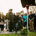 Kent Police, State Patrol troopers and others gather Nov. 26 to dedicate a memorial sign along Willis Street to Mike Buckingham, who led efforts to combat drunk driving in Kent for many years. COURTESY PHOTO, Kent Police