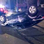 A car landed on its top Monday evening near the intersection of 108th Avenue Southeast and Southeast 204th Street. The driver suffered unknown injuries. COURTESY PHOTO, Kent Police