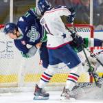 The Americans Samuel Stewart upends Thunderbirds center Henrik Rybinski in front of the crease during WHL action Friday night. COURTESY PHOTO, Brian Liesse, T-Birds
