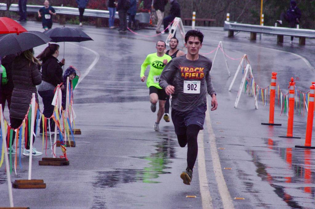 Enumclaws Dominic Deady, 19, kicks to the wire to take the mens 5K. MARK KLAAS, Kent Reporter