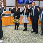 Kent Municipal Court Judge Michael Frans swears in City Council members, from left to right, Marli Larimer, Zandria Michaud, Bill Boyce and Les Thomas on Tuesday, Jan. 7, at City Hall. COURTESY PHOTO, City of Kent