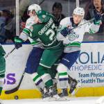 The Thunderbirds Henrik Rybinski, left, and Conner Bruggen-Cate sandwich the Silvertips Jake Christiansen during WHL play at the accesso ShoWare Center on Sunday. COURTESY PHOTO, Brian Liesse, T-Birds