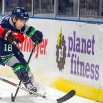 The Thunderbirds Andrej Kukuca chases the puck with a Winterhawk in pursuit during WHL play Saturday night. COURTESY PHOTO, Brian Liesse, T-Birds