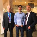 Dr. Joseph Foldyn, left, director of the Institute of Geonics of the Czech Academy of Sciences in Ostrava, Czech Republic, presented the Best Paper certificate to Michael Lo, middle, and Dr. Axel Henning, right of OMAX Corporation. COURTESY PHOTO