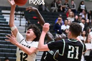 Trojans run away from Conquerors, take league’s top seed to district playoffs