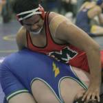 Kent-Meridians Sentuli Tuifua, top, tries to maneuver Hazens Jayden Hewitt during their 285-pound regional final last Saturday. Hewitt pulled out a 10-9 decision. MARK KLAAS, Kent Reporter