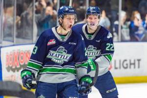The Thunderbirds Brendan Williamson, left, celebrates his first career WHL goal with Luke Bateman on Saturday night. Williamsons goal proved to be the game winner against rival Portland. COURTESY PHOTO, Brian Liesse, T-Birds