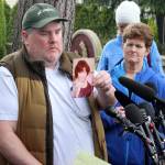 Mike Weatherill holds up a picture of his mother, Louise, at a March 5 press conference. Louise, who was a resident of Life Care, died yesterday. It is unknown whether she died from coronavirus. Blake Peterson/staff photo
