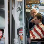 In defiance of Gov. Jay Inslees stay-home order, owner Bob Martin cuts a customers hair at The Stag barbershop on Saturday, May 2, 2020, in Snohomish, Wash. Dozens of people showed up and stood in line to get a haircut. Photo by Andy Bronson/The Herald