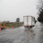 A truck travels through a flooded 76th Avenue South in Kent. A project this year will raise the road so it doesnt flood anymore. COURTESY PHOTO, City of Kent