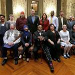 Democratic electors and state officials pose for a photo after a meeting of the states Electoral College in December 2016. Seated, from left, are Dan Carpita, Varisha Khan, Phillip Tyler, Julie Johnson, Elizabeth Caldwell and Levi Guerra. Standing, from left, are Esther John, Ryleigh Ivey, Robert Satiacum, Gov. Jay Inslee, Secretary of State Kim Wyman, Chris Porter, Eric Herde and Bret Chiafalo. Chiafalo, of Everett, along with John and Guerra did not cast their votes in the Electoral College for Democratic candidate Hillary Clinton, who won the states popular vote. (AP Photo/Elaine Thompson, file)