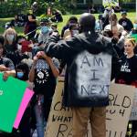 A man speaks to the crowd June 11 outside of the Maleng Regional Justice Center in Kent. STEVE HUNTER, Kent Reporter