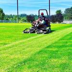 A city of Kent Parks Department employee mows the new natural grass turf at the renovated Riverbend Driving Range along West Meeker Street. The venus is not yet open. COURTESY PHOTO, City of Kent