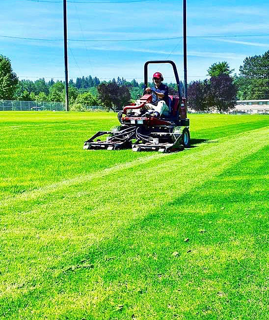 A city of Kent Parks Department employee mows the new natural grass turf at the renovated Riverbend Driving Range along West Meeker Street. The venus is not yet open. COURTESY PHOTO, City of Kent