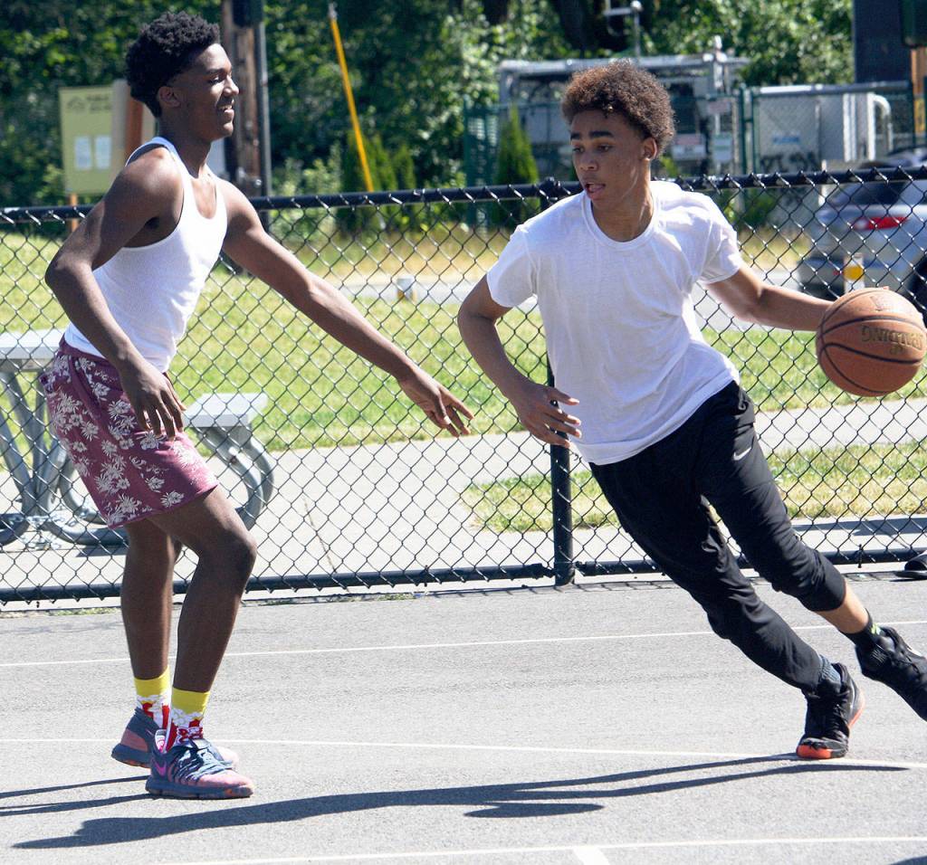 Two basketball players practice on a recent sunny day at West Fenwick Park. STEVE HUNTER, Kent Reporter