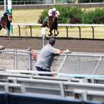 One man stands along the rail during opening day June 24 at Emerald Downs in Auburn. STEVE HUNTER, Kent Reporter