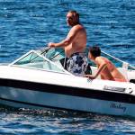 A man takes a boat for a spin on Monday at Lake Meridian. STEVE HUNTER, Kent Reporter