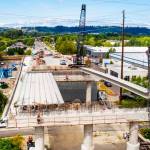 Crews place bridge girders on Aug. 3 for the South 228th Street overpass that will span the Union Pacific Railroad tracks and Interurban Trail. COURTESY PHOTO, Alex Klinger, City of Kent Public Works, via drone