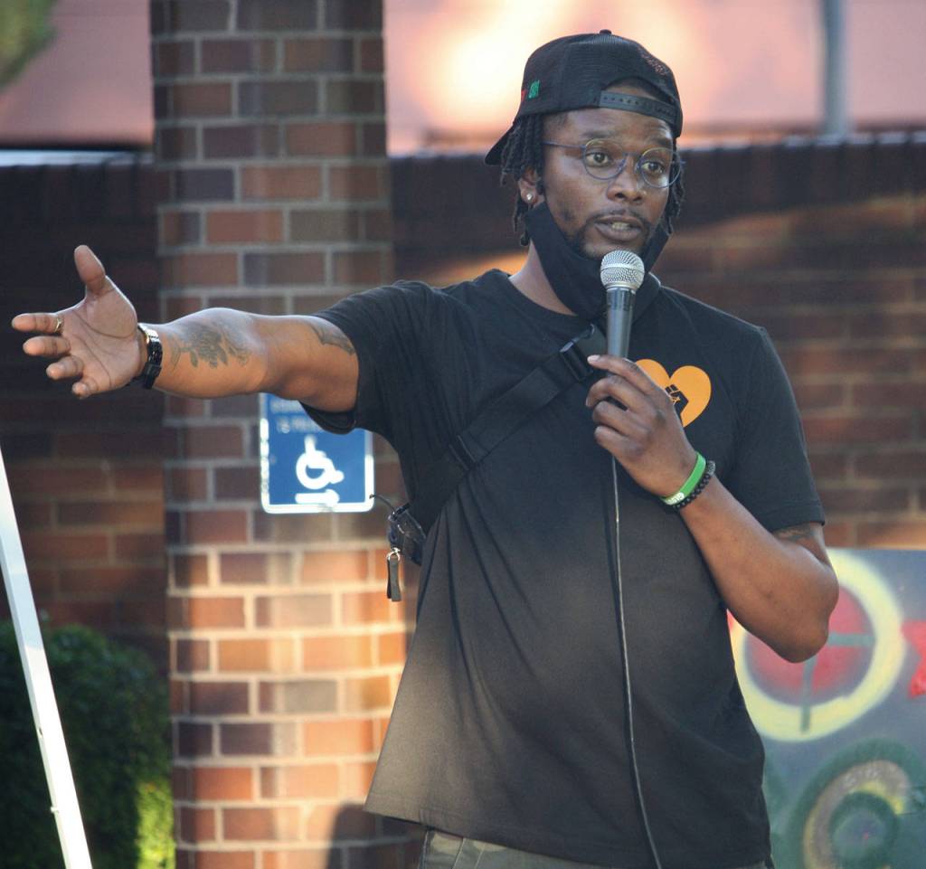 Kendrick Glover speaks at a protest rally Aug. 17 outside of the Kent Police Department. STEVE HUNTER, Kent Reporter