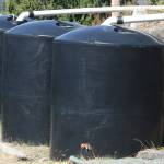 Cisterns store rainwater collected from the Hillside Church rooftop to help water the community garden. STEVE HUNTER, Kent Reporter