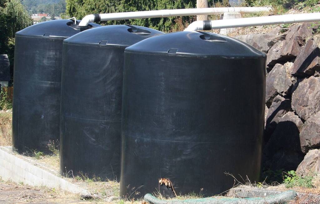 Cisterns store rainwater collected from the Hillside Church rooftop to help water the community garden. STEVE HUNTER, Kent Reporter