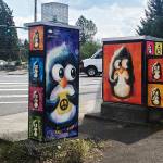 Vikram Madans Perplexed Penguins peer out from a striking color-block background at SE 272nd Street (Kent-Kangley Rd.) and 152nd Avenue SE. The curious little birds appear holding a variety of fanciful objects, from hearts and butterflies to lollipops and a tiny accordion. COURTESY PHOTO, City of Kent