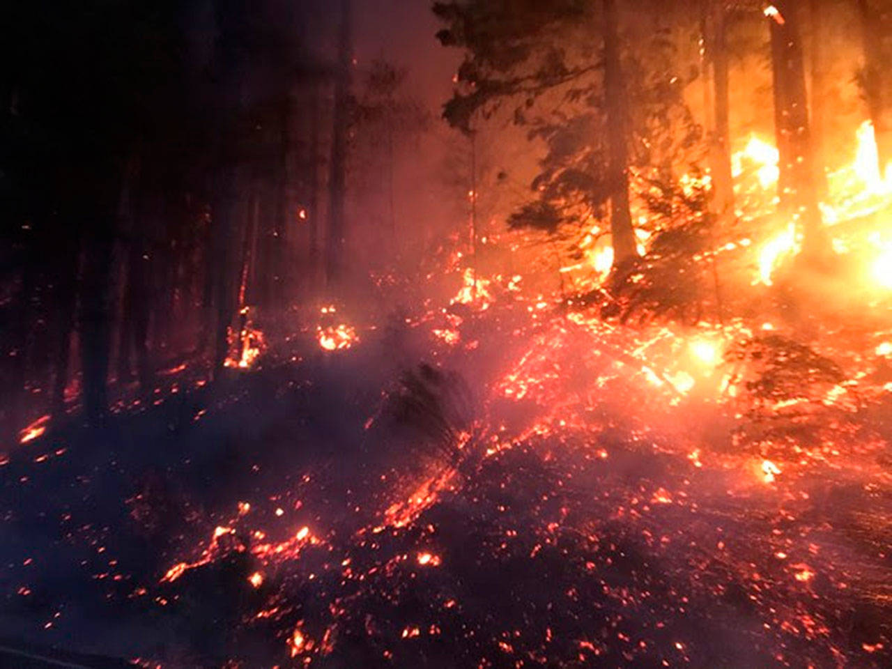Fire burns the hillside near SR 410 in Enumclaw the morning of Sept. 9. COURTESY PHOTO, state Department of Transportation