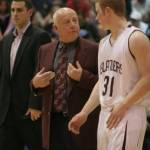 Ed Pepple speaks with Islander Evan Zahniser in 2008 at halftime of a district playoff game while assistant Gavin Cree stands in the background. The team finished 22-5 that season and was 16-0 in Kingco. Photo courtesy of the Mercer Island School District