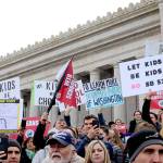 Protesters hold signs advocating a veto on Senate Bill 5395 earlier this year. WNPA News Service