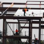 Crews work Tuesday, Oct. 6 on the new Kent School District elementary school going up along Military Road South on the West Hill. STEVE HUNTER, Kent Reporter
