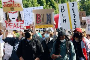 A Black Lives Matter peaceful protest march in June through downtown Kent inspired a group called ForFortyTwo to demand that the city of Kent defund police and listen to the BIPOC (Black, Indigenous and People of Color) community. FILE PHOTO, Kent Reporter