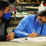 Two voters fill out their ballots Tuesday, Nov. 3 at the Vote Center inside the accesso ShoWare Center in Kent. STEVE HUNTER, Kent Reporter