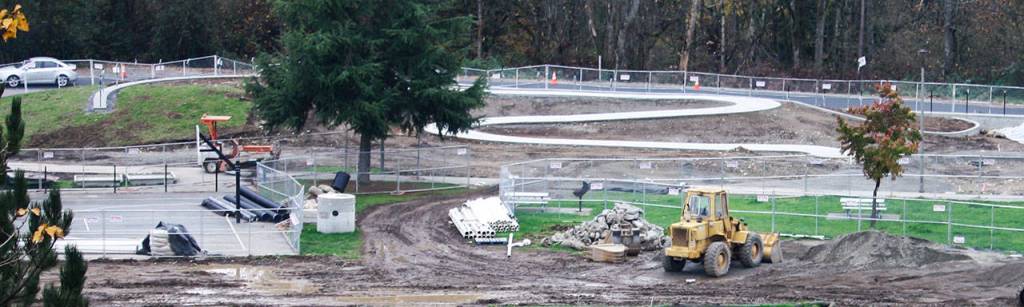 The winding sidewalk at the top of this photo will serve as part of the interactive board game Chutes and Ladders at West Fenwick Park. When the project is installed, it will allow children and adults to play the board game as they interact with elements in the playground. STEVE HUNTER, Kent Reporter