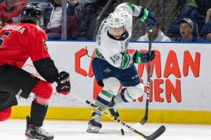 Seattles Mekai Sanders maneuvers the puck up the ice during WHL play Feb. 23 at the accesso ShoWare Center. COURTESY FILE PHOTO, Brian Liesse, T-Birds