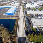 Aerospace company Blue Origin, blue building on the left, is one of the many businesses served by 76th Avenue South, which has been raised 3 feet to reduce flooding. City staff used a drone to take this photo. COURTESY PHOTO, City of Kent