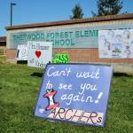 Teachers placed signs in front of Sherwood Forest Elementary School in Federal Way for students in April 2020. Olivia Sullivan/the Mirror
