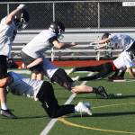 Kentlake High players work on a tackling drill during their first practice March 1 in preparation for games to begin March 12. STEVE HUNTER, Kent Reporter