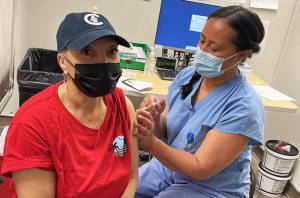 Wanda Herndon, receives COVID-19 vaccine number 100,000 administered by UW Medicine at Harborview Medical Center in Seattle. COURTESY PHOTO, Susan Gregg | UW Medicine