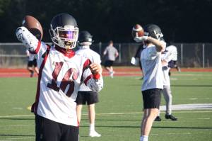 Kentlake High players practice in preparation for playing Kentwood on Friday night, March 12. STEVE HUNTER, Kent Reporter